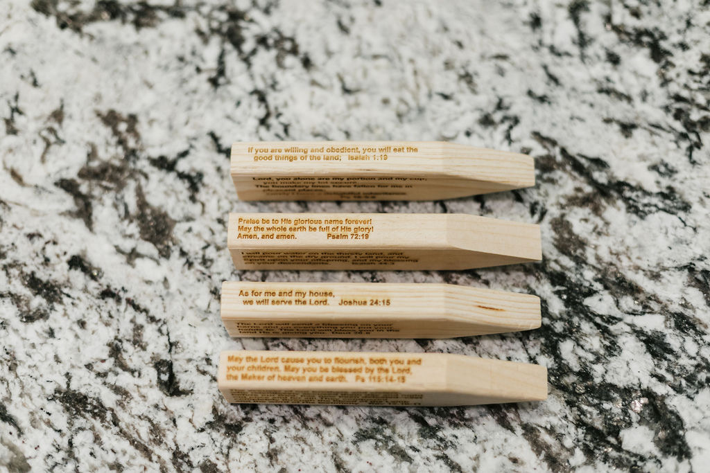 Engraved wooden stakes with Scripture — Isaiah 1:19, Psalm 72:19, Psalm 115