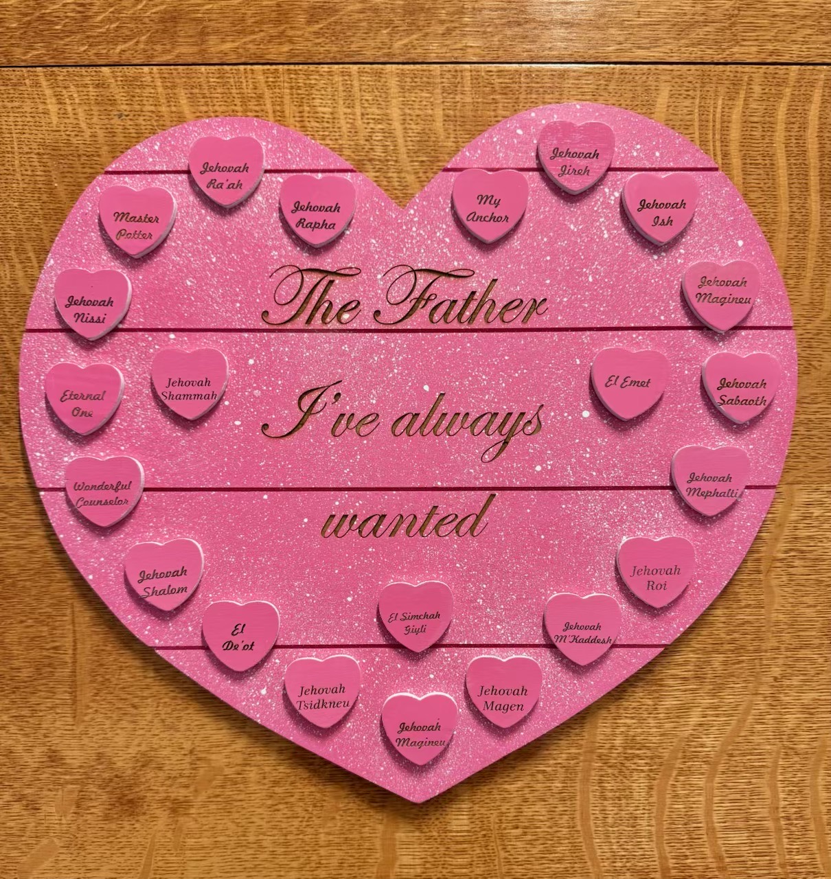 Pink glitter heart-shaped board reading "The Father I've always wanted" with heart name tokens