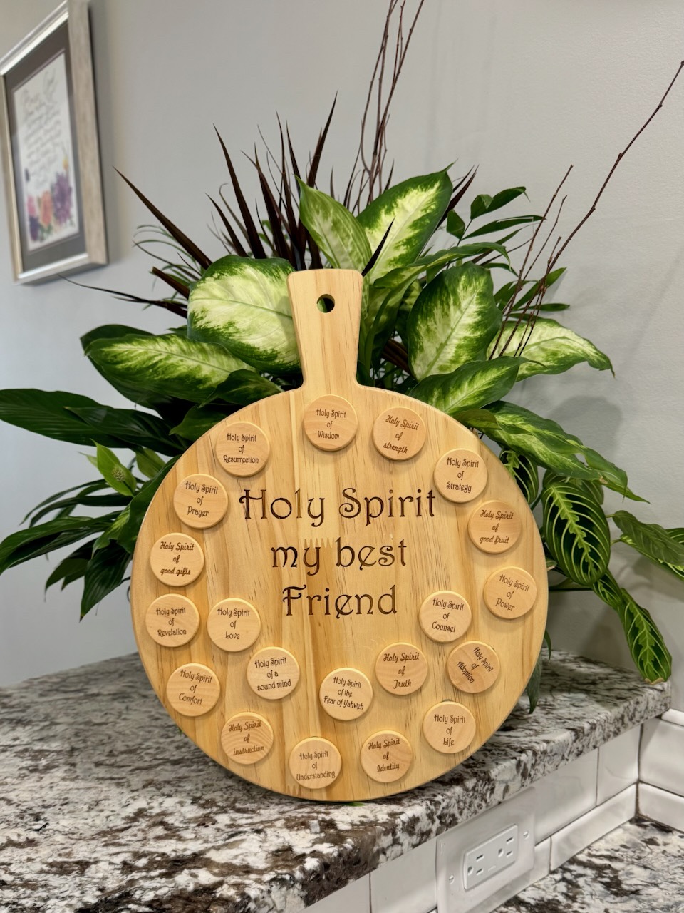Round wooden board reading "Holy Spirit my best Friend" surrounded by round name tokens