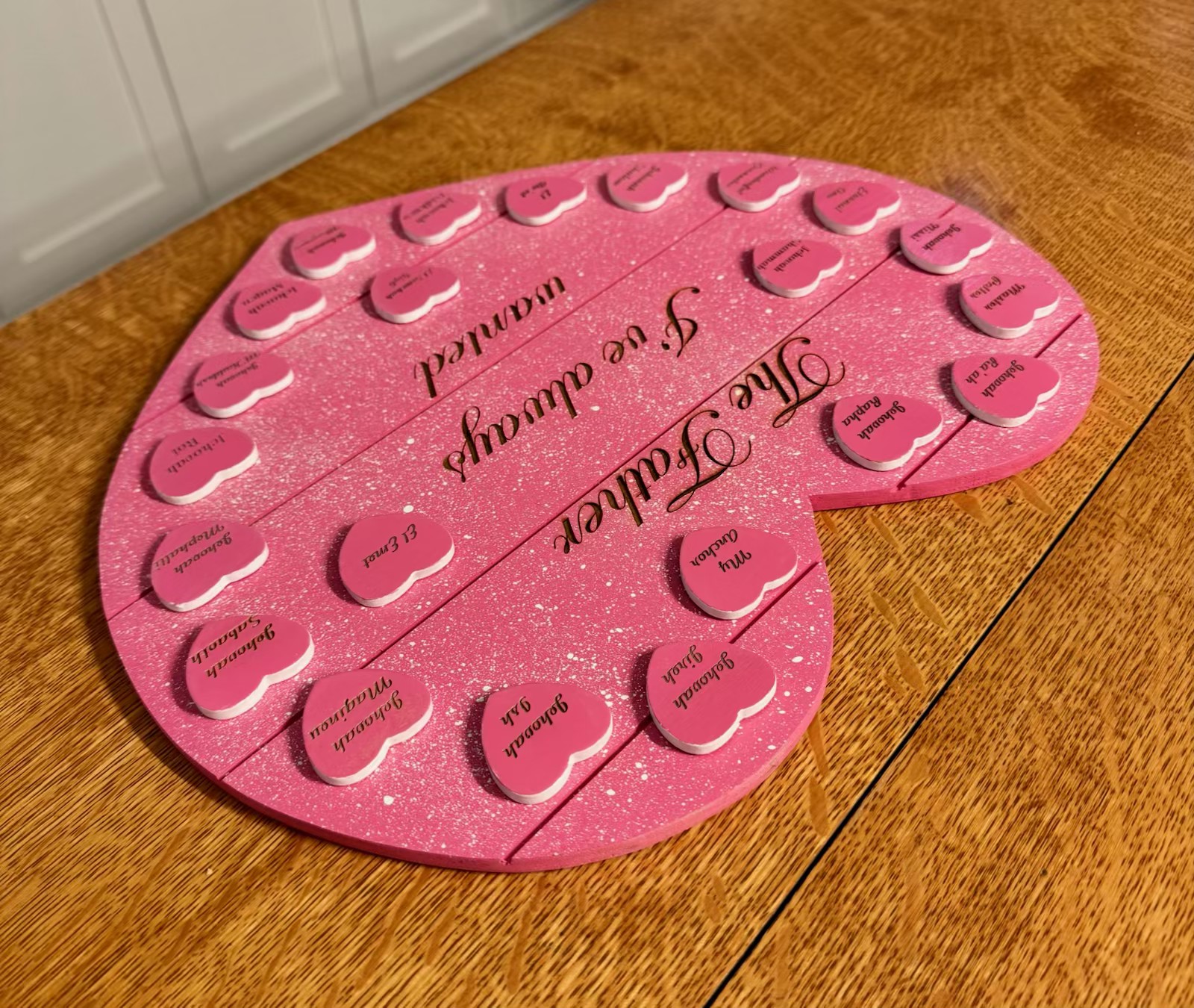 Additional view of the pink glitter heart board with heart name tokens